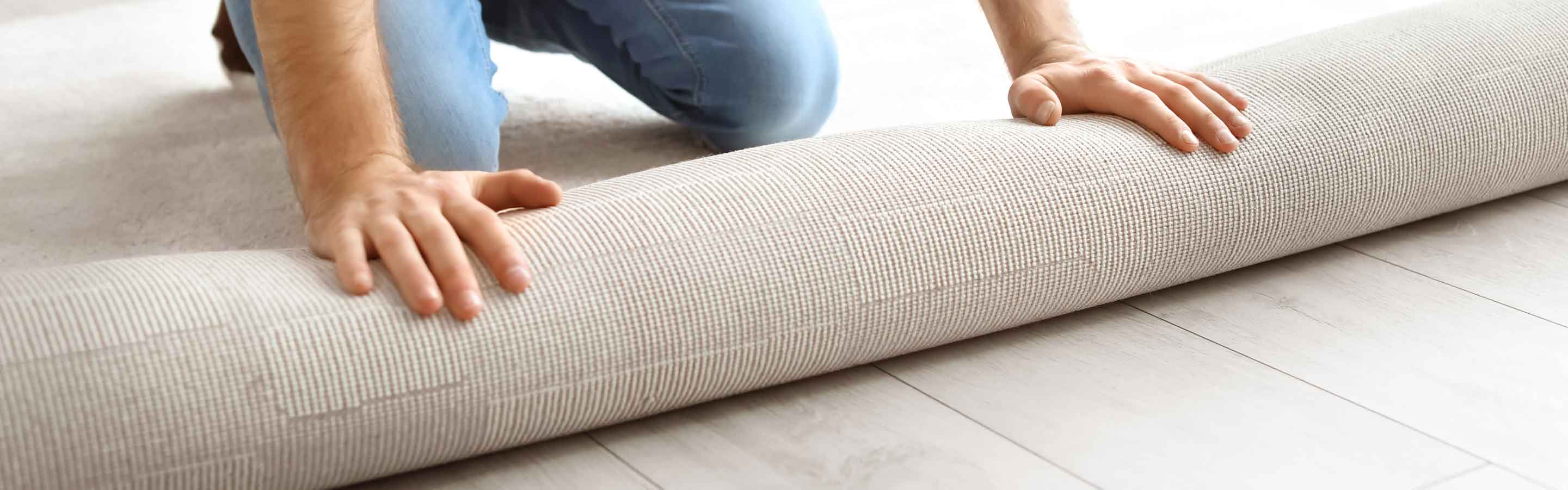 man installing carpet